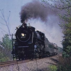 Engine 819 steams down the track, bound for Fordyce.