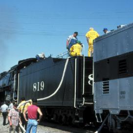 Engine 819 takes on water at a stop in Maulden, Missouri.